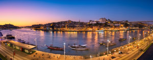 Panorama of Porto with the Dom Luiz bridge and traditional port wine transport boats, Portugal Panorama of Porto with the Dom Luiz bridge and traditional port wine transport boats, Portugal
